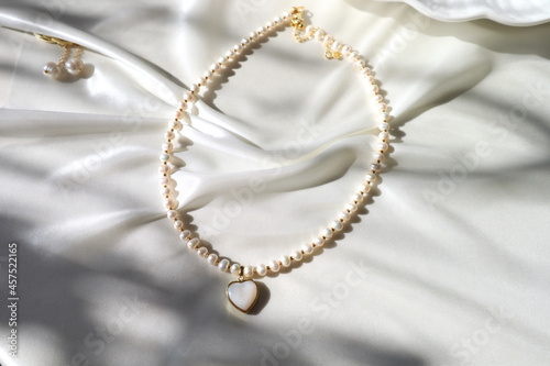 pearl necklace in the shape of a heart