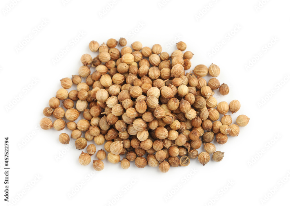 Heap of dried coriander seeds on white background, top view Heap of dried coriander seeds on white background, top view