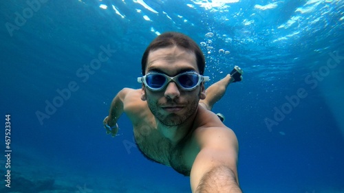 young man snorkeling in Menorca
