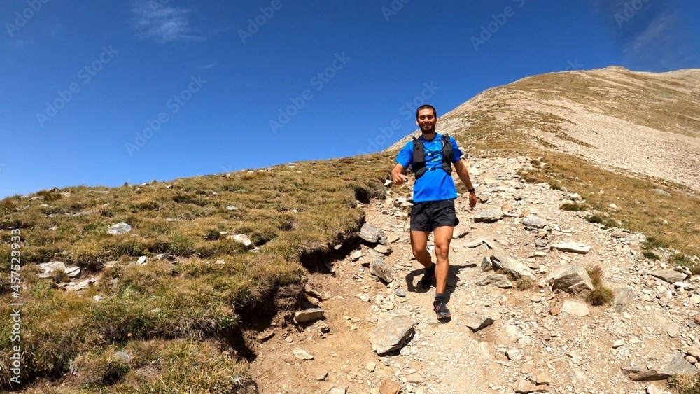 young man hiking in the mountains