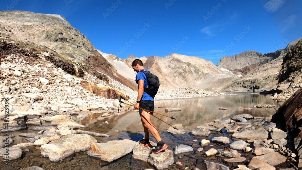 Fototapeta premium young man hiking in the mountains