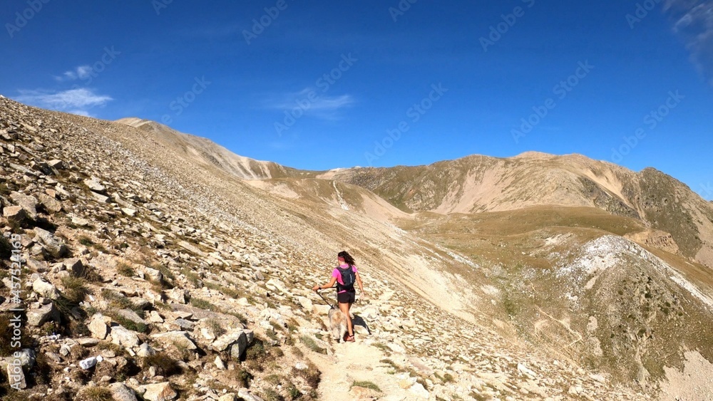 young woman hiking in the mountains