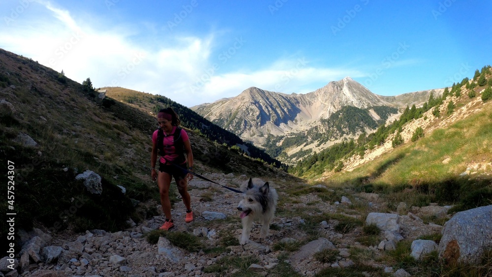 young woman hiking in the mountains