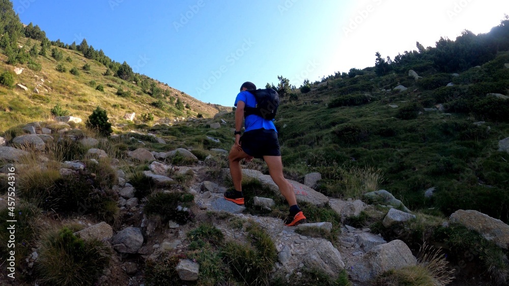 Fototapeta premium young man hiking in the mountains