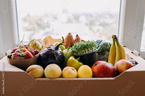 Fototapeta Naklejka Na Ścianę i Meble -  Box full of various organic fruits and vegetables. Food delivery concept.