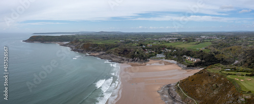 Canvas Print The huge surfing beach of Caswell Bay, on the South Wales Coast Path, at low tid