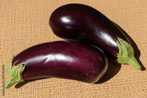 Two fresh ripe eggplants closeup.