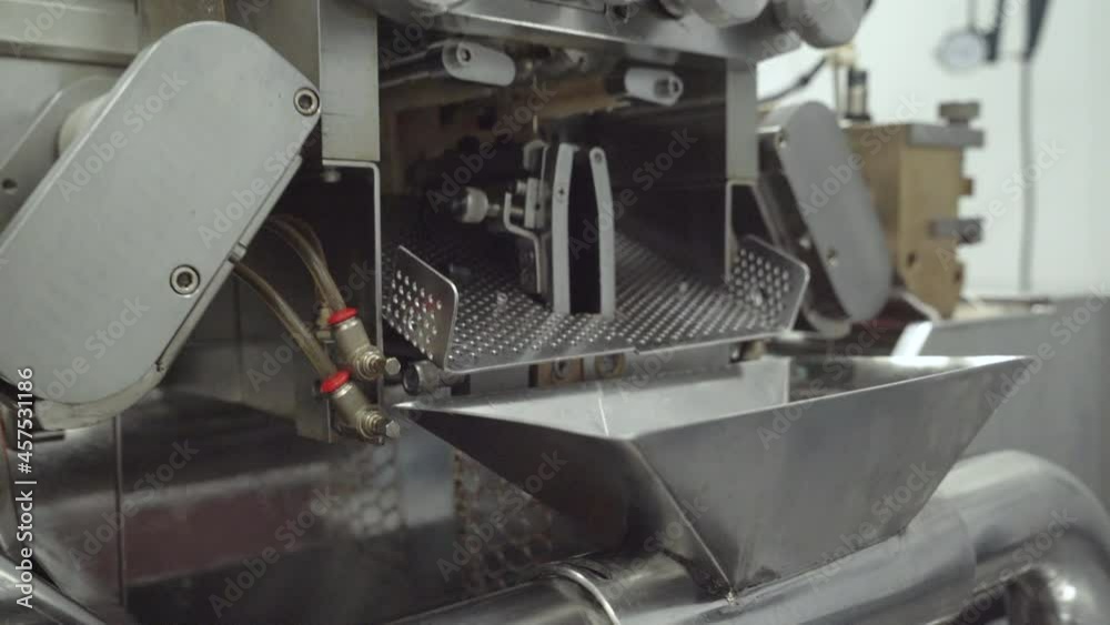 Close up of CBD capsule manufacturing machine in laboratory Close up of CBD capsule manufacturing machine in laboratory