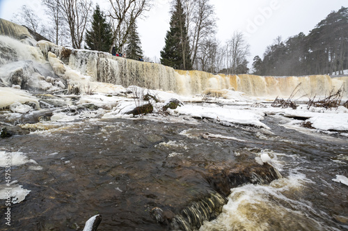 Partly frozen Keila-Joa waterfall in winter photo