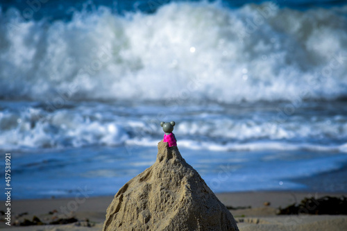 Toy on sand castle photo