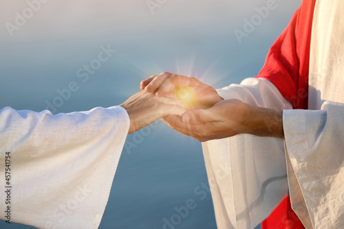Obraz na plátne Jesus Christ and woman near water outdoors, closeup