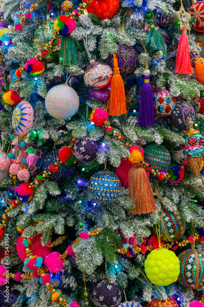 A festively decorated Christmas tree. Bright festive background.