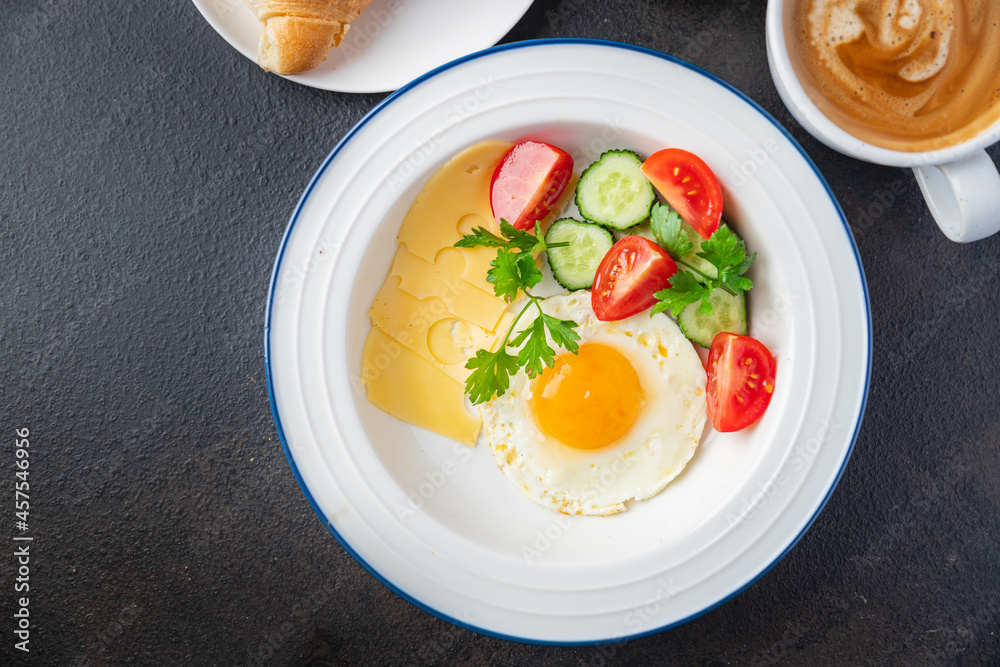 breakfast fried eggs and a cup of coffee liquid egg yolk fresh portion ready to eat meal snack on the table copy space food background rustic. top view keto or paleo diet veggie or vegetarian breakfast fried eggs and a cup of coffee liquid egg yolk fresh portion ready to eat meal snack on the table copy space food background rustic. top view keto or paleo diet veggie or vegetarian