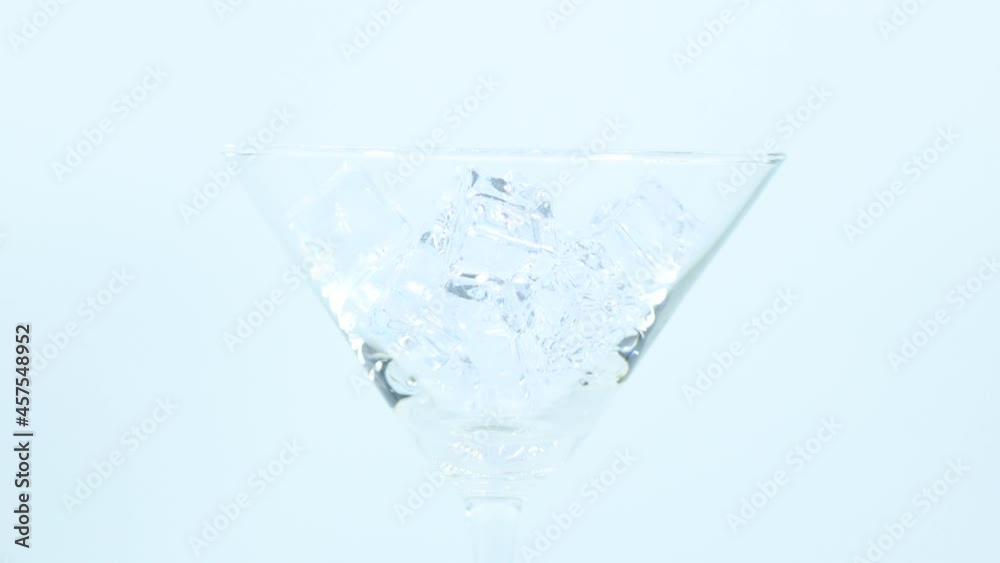 360 degree rotation video 4K Close-up Pouring Blue Hawaii into a glass ...