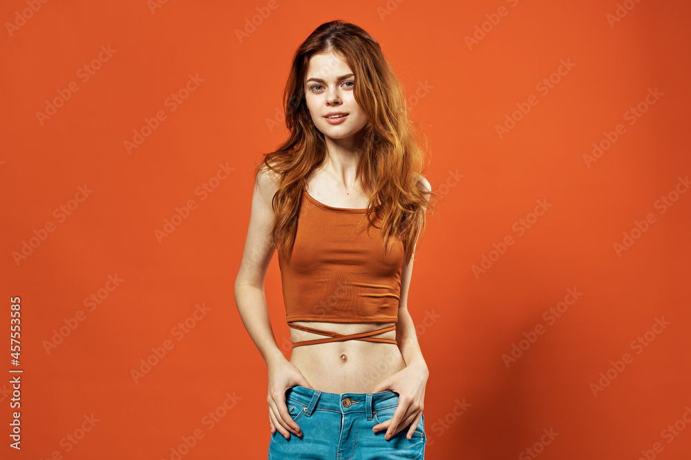 attractive woman holding hair red t-shirt studio summer decoration attractive woman holding hair red t-shirt studio summer decoration