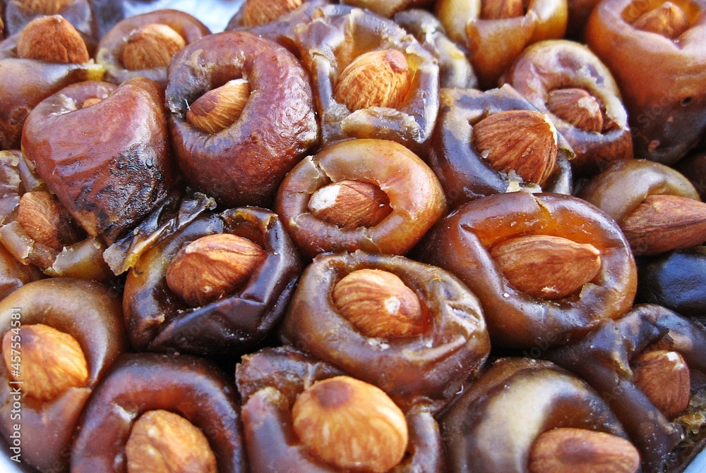 Date palm or date fruit without seed and fill with almond as background