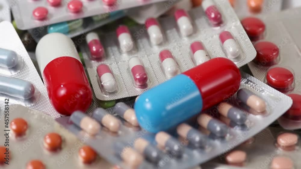 Closeup shot of moving pile of medicine with big pills on top Closeup shot of moving pile of medicine with big pills on top
