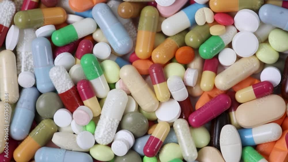 Closeup loop of pile of pills and capsules rotating Closeup loop of pile of pills and capsules rotating