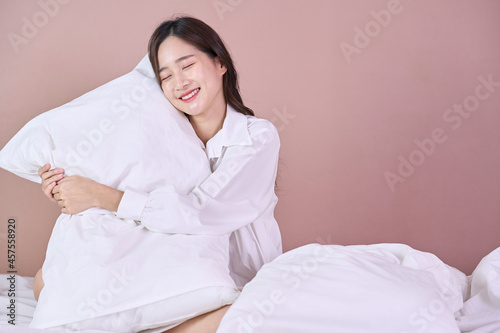 funny and cute woman happy on bed