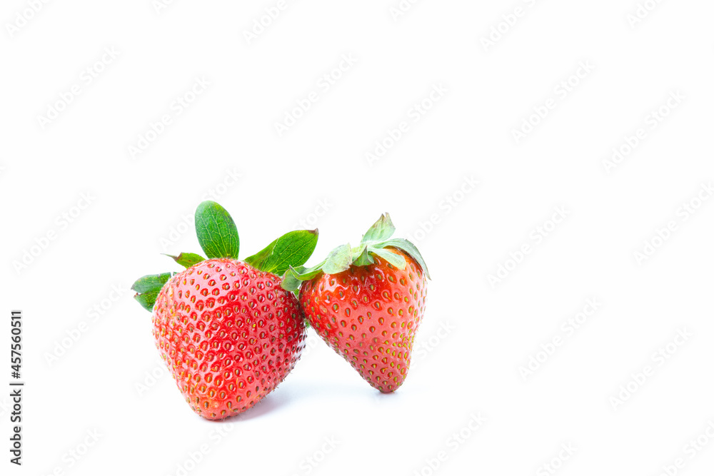 Two strawberries isolated on white background with copy space. Fruit have high vitamins. Two strawberries isolated on white background with copy space. Fruit have high vitamins.