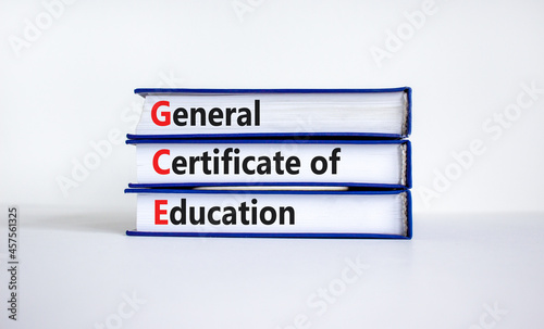 GCE, general certificate of education symbol. Words GCE, general certificate of education on books on a beautiful white background. Education, general certificate of education concept. Copy space.