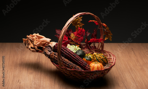 thanksgiving day corns and pumpkins in basket