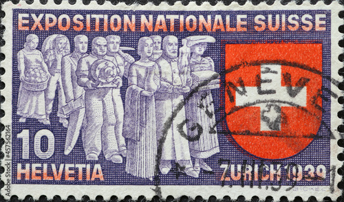 Switzerland - Circa 1939: a postage stamp printed in the Switzerland showing some Swiss people who are bringing their work to the exhibition. State exhibition in ZURICH