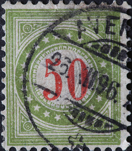 Switzerland - Circa 1878: a postage stamp printed in the Switzerland showing a circle with stars and a number in the middle. Postage only for non-profit institutions No 50