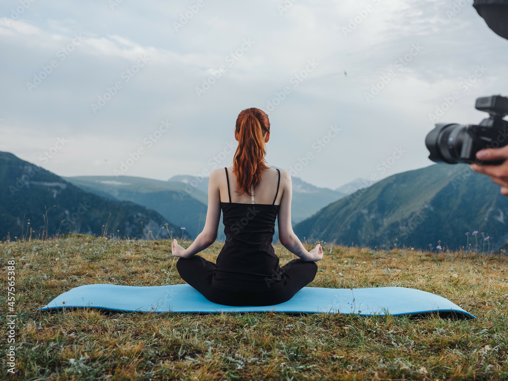 woman meditates in nature in the mountains of pacification freedom