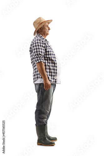 Full length profile shot of a mature farmer standing