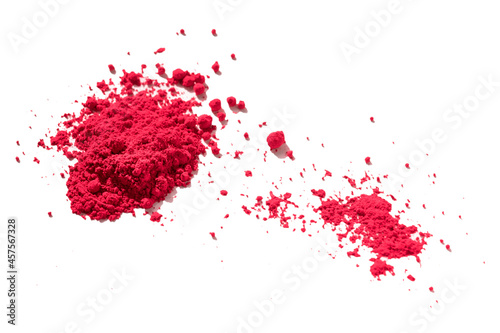 Close up of a large and a small portion of red pigment isolated on white in side view. The pigment will be mixed with linseed oil to make oil paint