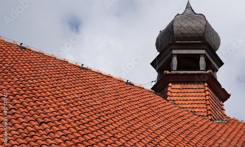 General view and architectural details of the Catholic Church of Our Lady of the Rosary in Iłowo Osada na warmi in Poland. photo