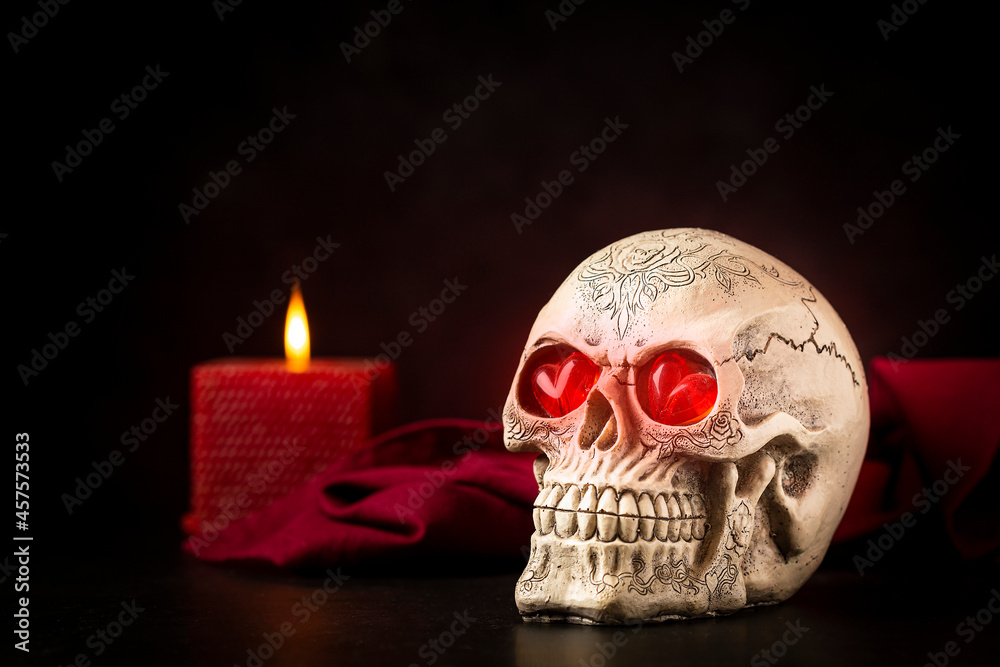 Halloween catrine skull on an black table in dark background. Halloween catrine skull on an black table in dark background.