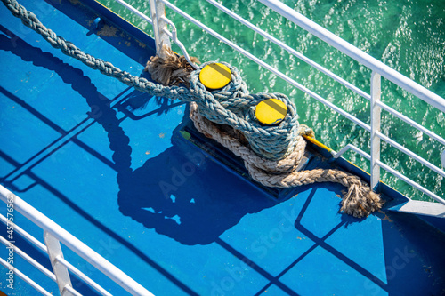 Ship ropes  around the mooring bollard photo