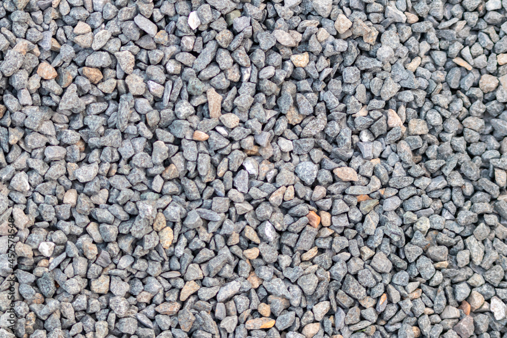 Raw rocks and minerals as natural stones background with crushed and rough material at a rough coast or rocky beach show nuggets and sandstones in harmonic pastel colors as natural mineral background