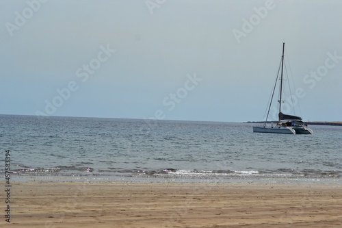 A ship, sand and the sea in a beach of Lanzarote