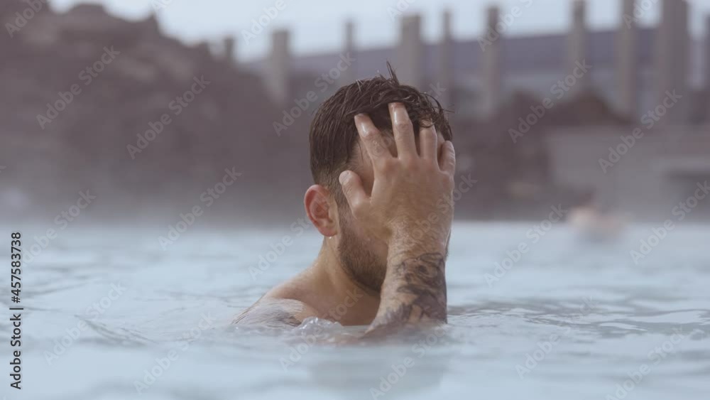 Young Man Relaxing In Lagoon Geothermal Spa