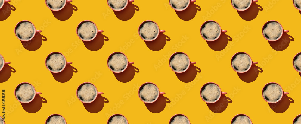 Pattern of coffee mugs on yellow pastel background Pattern of coffee mugs on yellow pastel background