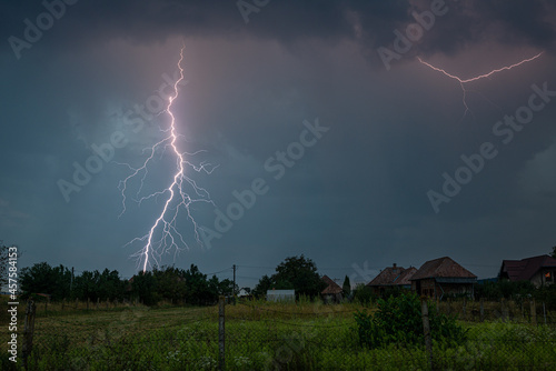 A powerful bolt of lightning strikes near a village in Romania