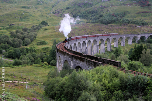 A view of the Glenfinnan Viaduct with a steam train going over