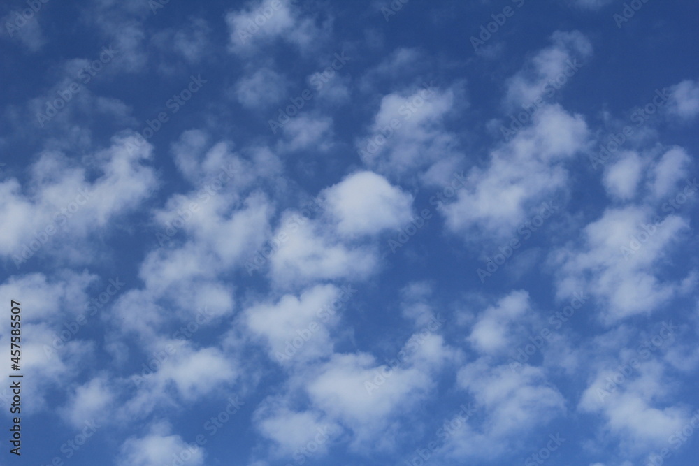 a beautiful cloudscape with lots of little white clouds in a blue sky a beautiful cloudscape with lots of little white clouds in a blue sky