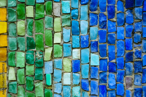 Multicolored small square tiles of an abstract background with a pattern. Soviet mosaic. green-blue background of a large number of small tiles