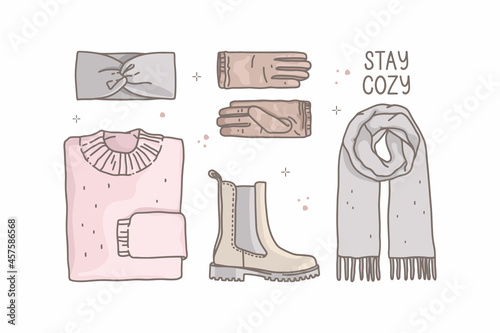 Vector fashion illustration in sketch style. Outline drawing, pastel colors. Warm clothes, "stay cozy" lettering. Scarf, knitted sweater, boots, gloves, headband. Autumn, winter things. Icons set.