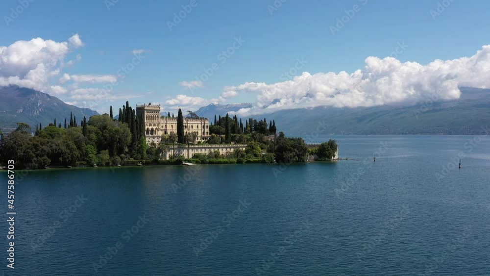Point of interest, Isola del Garda, Italy. Historic sites on Lake Garda. Castle on an island in Italy. Drone panorama at Isola del Garda, Lake Garda, Italy. An island surrounded by the Italian Alps. Point of interest, Isola del Garda, Italy. Historic sites on Lake Garda. Castle on an island in Italy. Drone panorama at Isola del Garda, Lake Garda, Italy. An island surrounded by the Italian Alps.