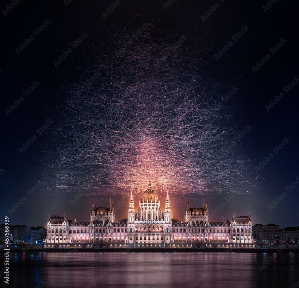 Seagull bird cloud over the night lights of beautiful building Parlament Parliament in Budapest Hungary long exposure