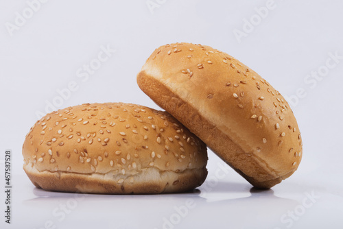 Cheeseburger bun on white isolated background. Two Hamburger buns with sesame isolated on white background