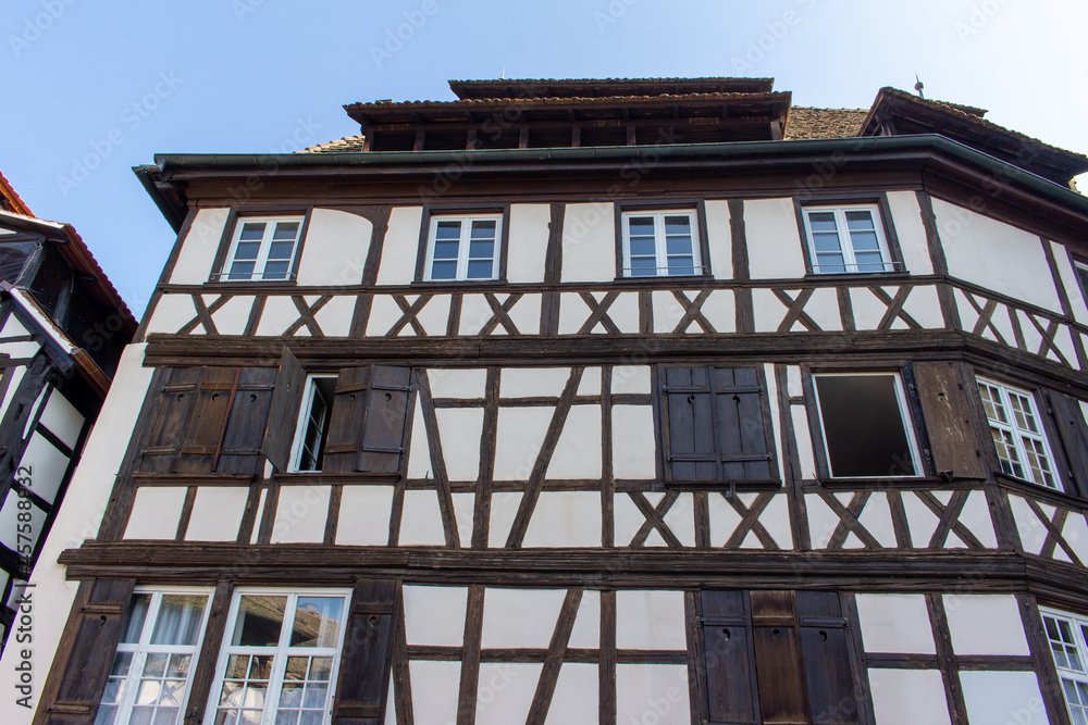 Close upward exterior view of traditional German timber-framed building architecture in Strasbourg, France