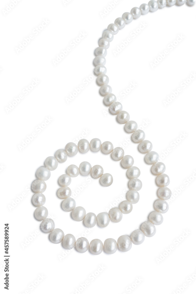 Spiral ornament figure made of pale pearl necklace with shadow, isolated on white background