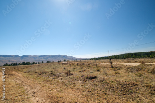 Dirt road among the mountains in rural farmlands in South Africa © fotorudi_101