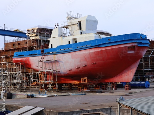 Ship construction, ship dock, tug under repair